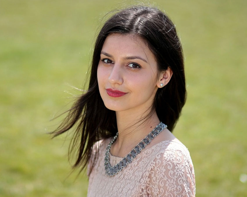 Woman with black hair.