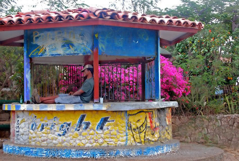 Man sleeping on a kiosko.