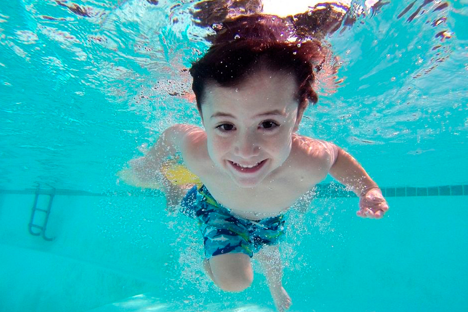 Boy swimming in the pool