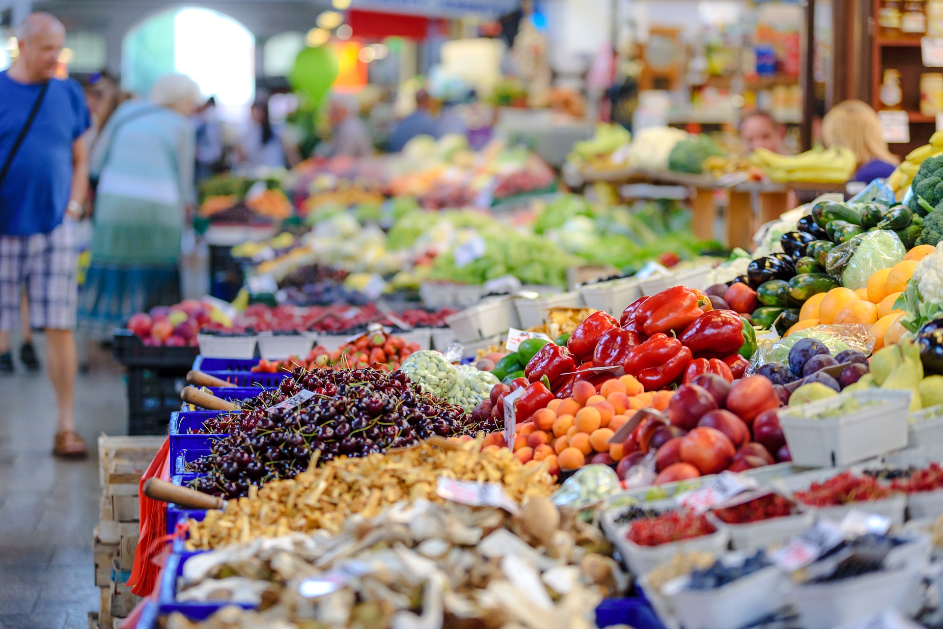 Two elderly and one market stall